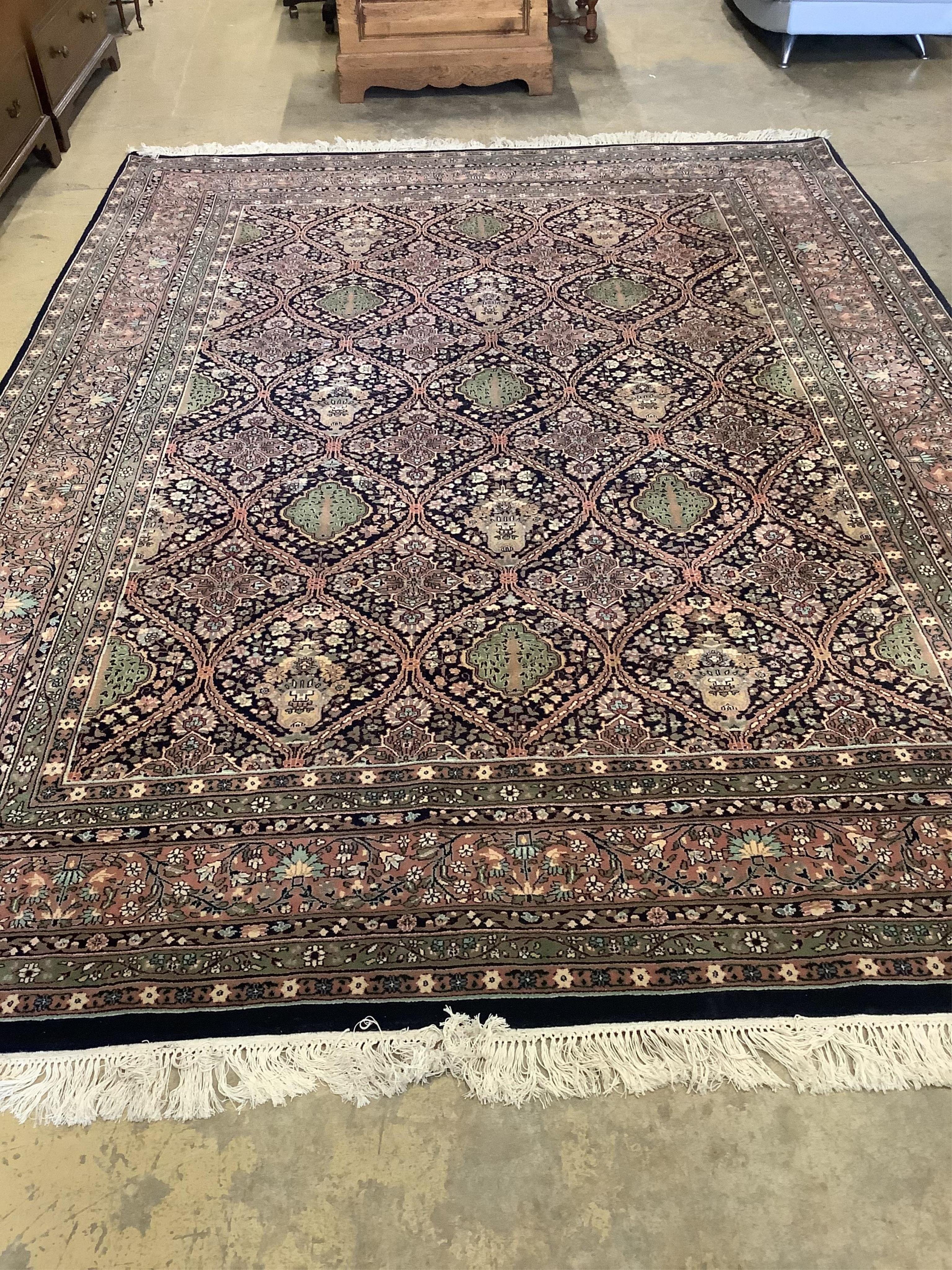 An Indian wool carpet, 372 x 274cm. Condition - good